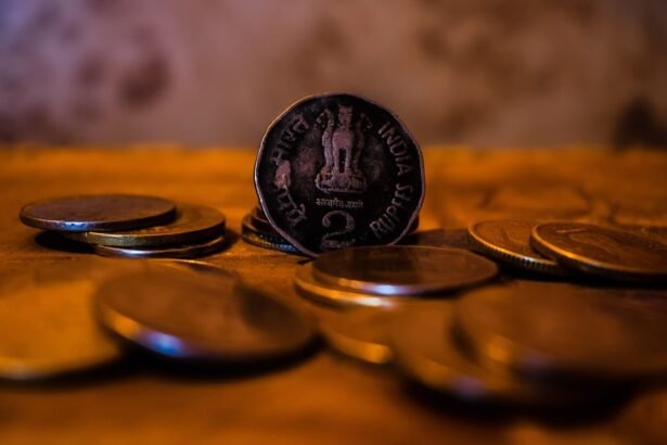 A close-up of indian coins on a wooden surface